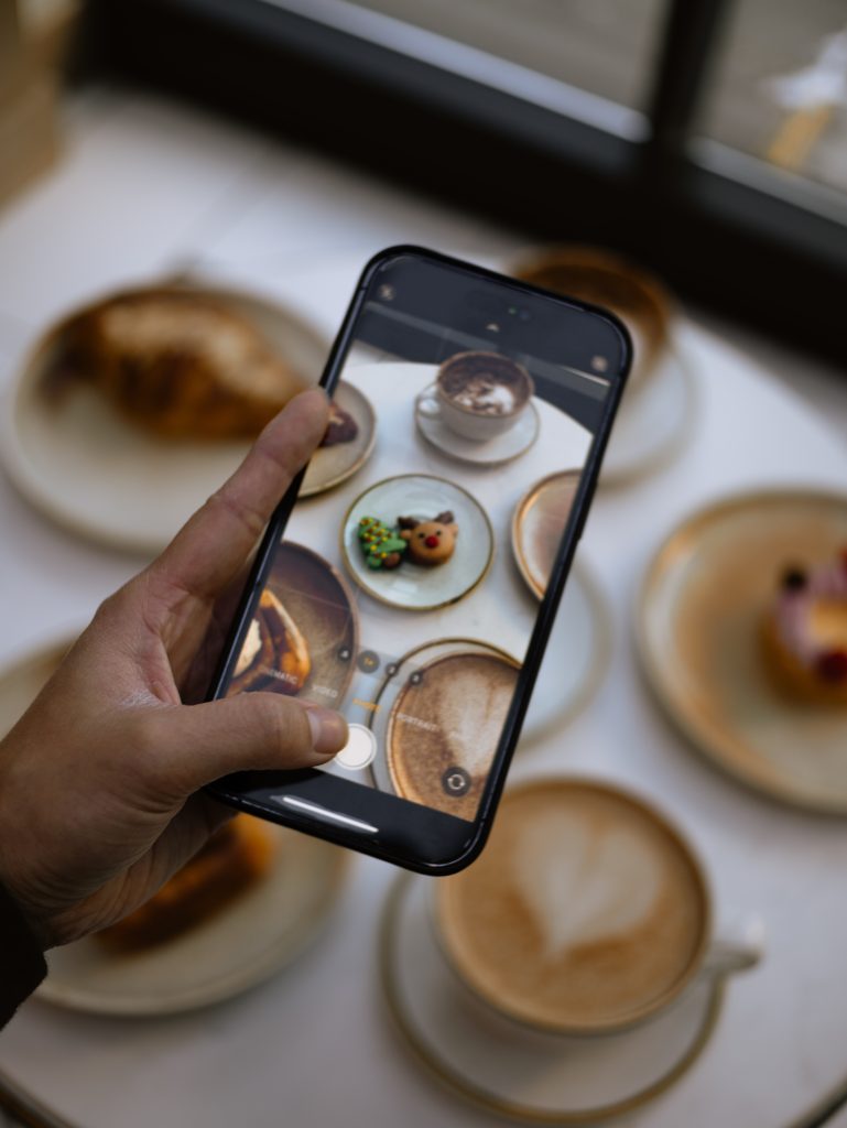 taking a photo of coffee and desserts