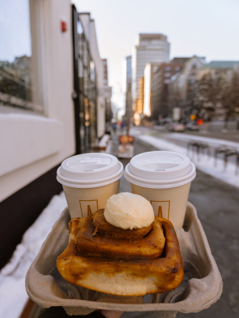 cinnamon roll and coffees to go