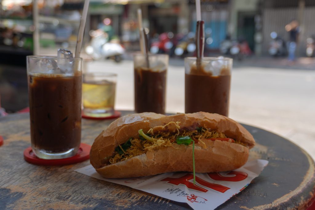 Vietnam One Day Itinerary - Eating Banh Mi for breakfast and a Vietnamese Iced Coffee